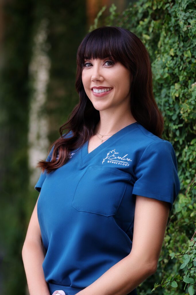 Professional headshot of Dr. Toni Hodges-Wills, gynecologist in Las Vegas, wearing blue scrubs